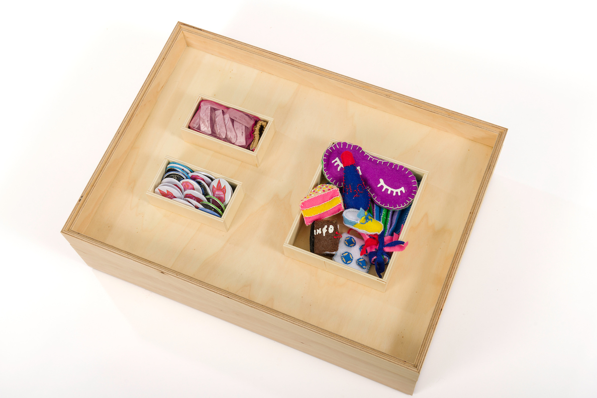 a box draw containing brightly coloured artefacts