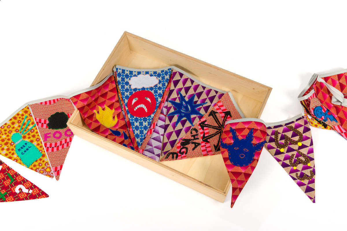 appliqued bunting in a box. images depict sad faces, fire and temperature symbols