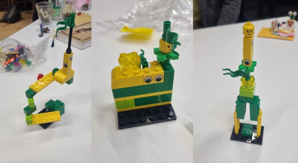 three different towers of lego made form green and yellow bricks