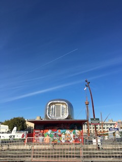 Image of a small building with a blow up silver tent on top. 